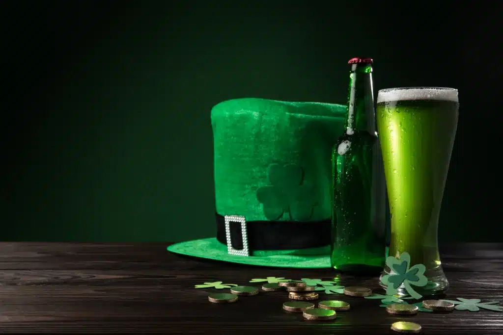 Green Hat With Green Beer And Coins On Wooden Table, St Patricks Day Concept